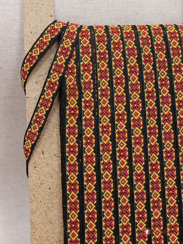 Жак.лента 10мм Красно-желтые цветы-снежинки на черном